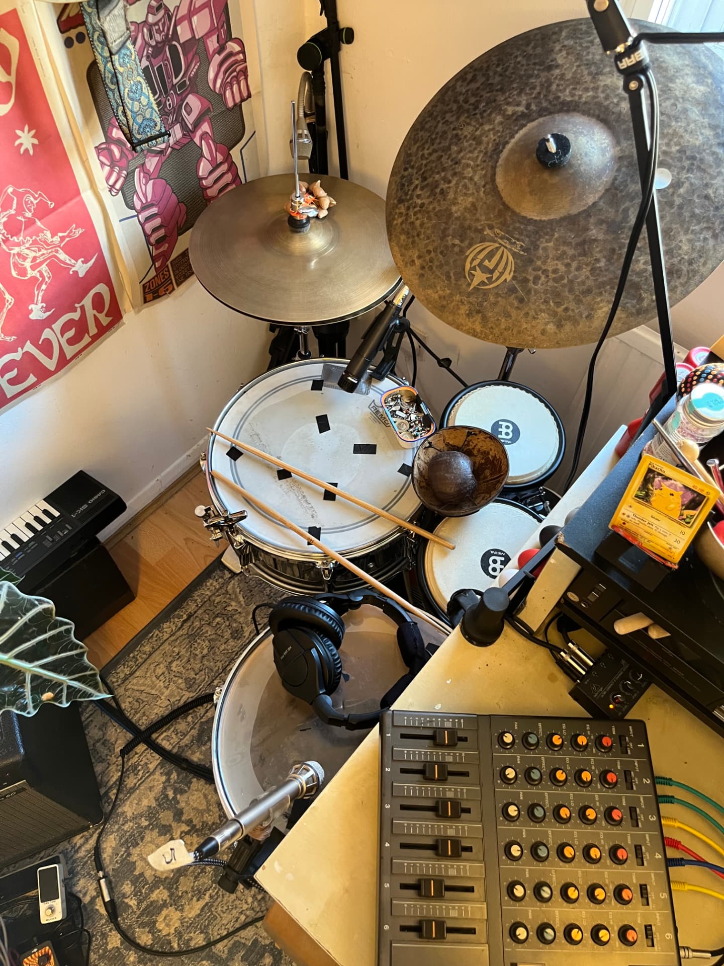 The drum kit beside the mixing desk and outboard gear in Maximo's studio